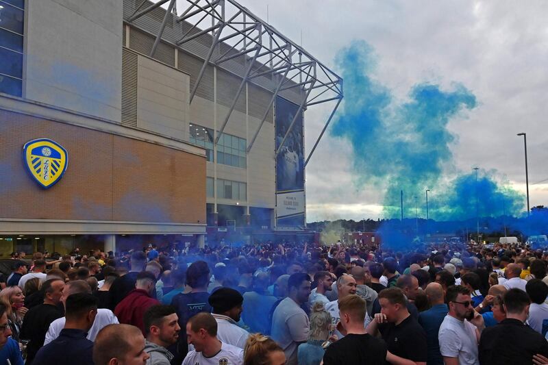 Leeds United supporters gather outside their Elland Road ground to celebrate the club's return to the Premier League after a gap of 16 years. AFP