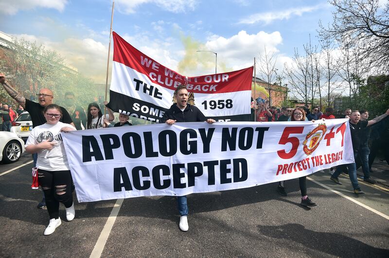 Manchester United fans take part in a protest outside the stadium. Getty