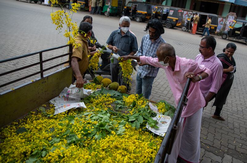 Flowers of the golden shower tree and jackfruit are sold on the eve of Vishu festival in Kochi, Kerala. AP Photo