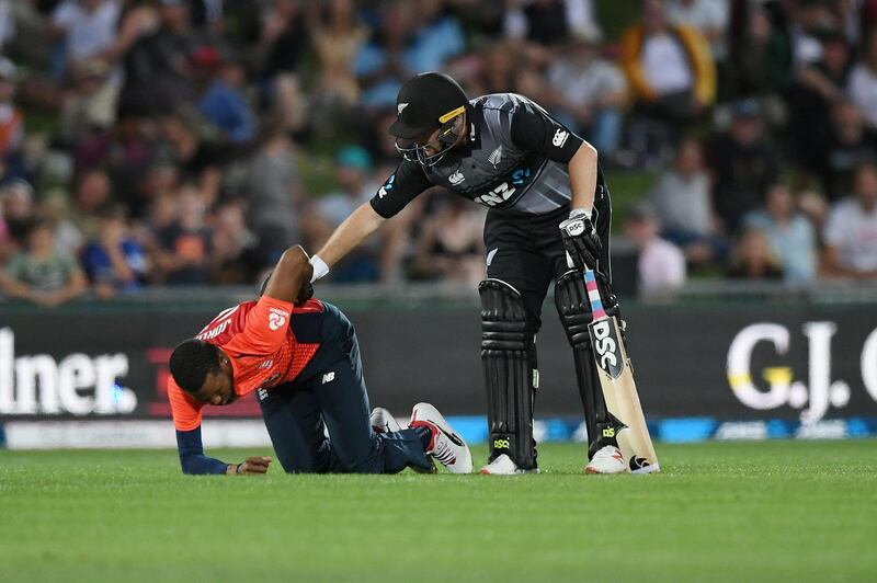 Colin Munro of New Zealand after colliding with England bowler Chris Jordan. Getty