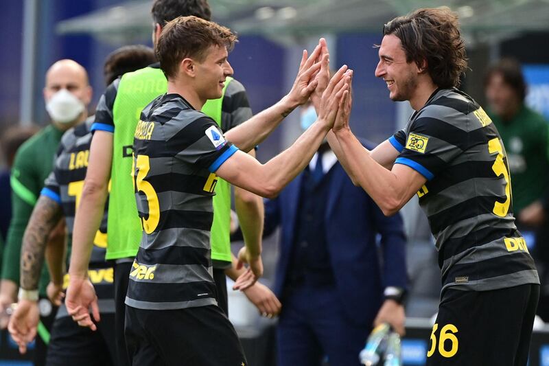 Inter Milan's Italian defender Matteo Darmian celebrates with Nicolo Barella. AFP