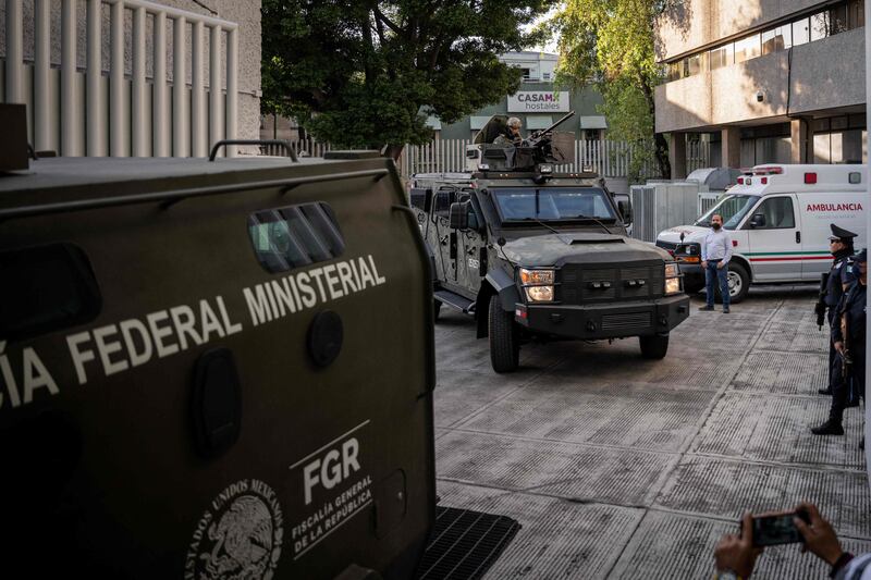 Armoured vehicles at the Attorney General's Office for Special Investigations on Organised Crime in Mexico City, after Guzman's arrest. AFP