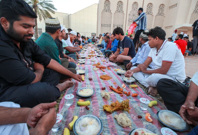 Abu Dhabi residents gather at Mary Mother of Jesus Mosque to break fast on the second day of Ramadan. Victor Besa / The National
