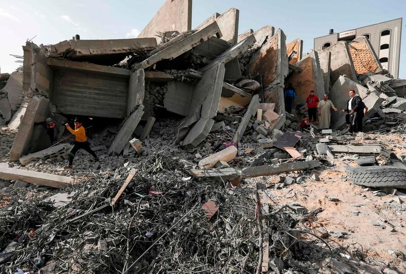 A man looks at a damaged building in Gaza City. AFP