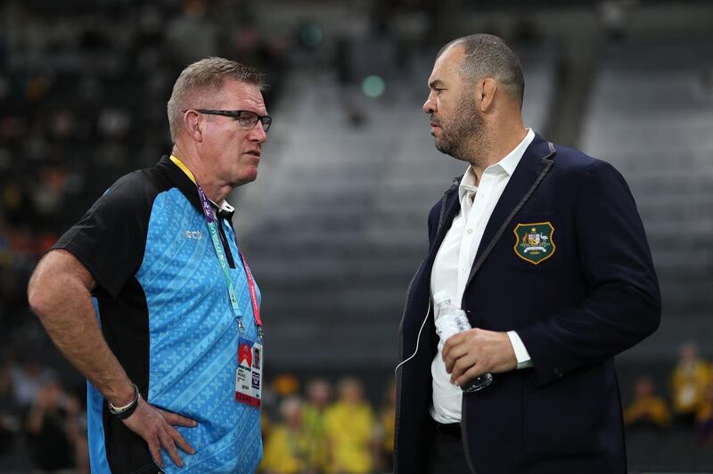 SAPPORO, JAPAN - SEPTEMBER 21: Michael Cheika (R) of Australia and John McKee (L) of Fiji talk prior to the Rugby World Cup 2019 Group D game between Australia and Fiji at Sapporo Dome on September 21, 2019 in Sapporo, Hokkaido, Japan. (Photo by Dan Mullan/Getty Images)