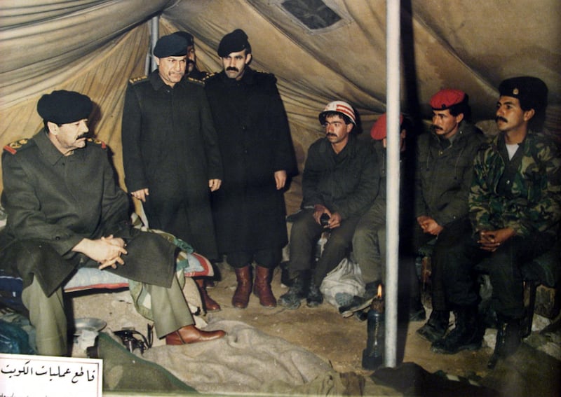 Saddam Hussein visits Iraqi troops at a military camp in occupied Kuwait after the 1990 invasion of the Gulf state. AFP