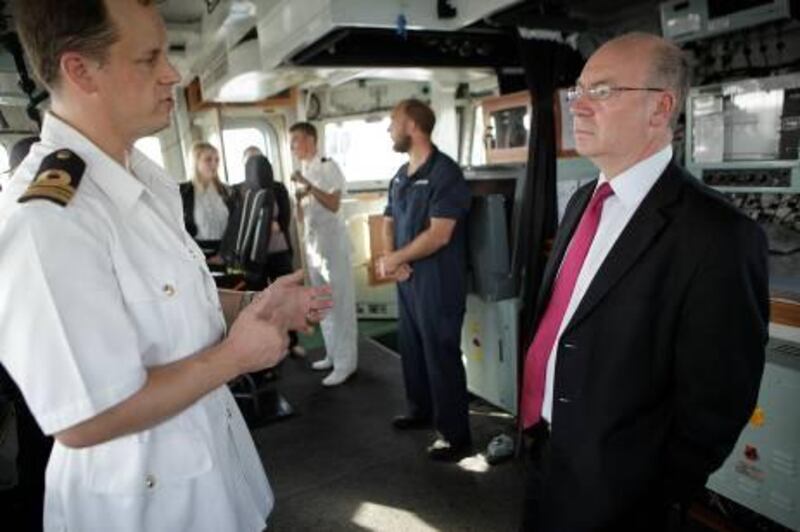 Sept 6, 2011 (Abu Dhabi) Lt. Commander Richard Hutchings captain of the HMS Pembroke speaks with Alistair Burt the Minister for Middle East and South Asia for the United Kingdom about the HMS Pembroke and the ships mission in the Middle East.  (Sammy Dallal / The National)