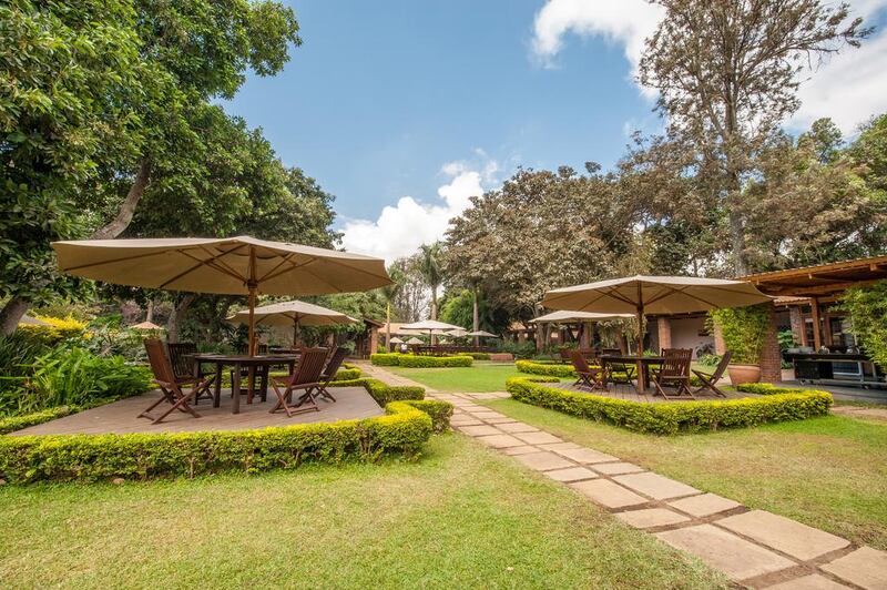 The garden at Arusha Coffee Lodge. Courtesy Elewana Collection