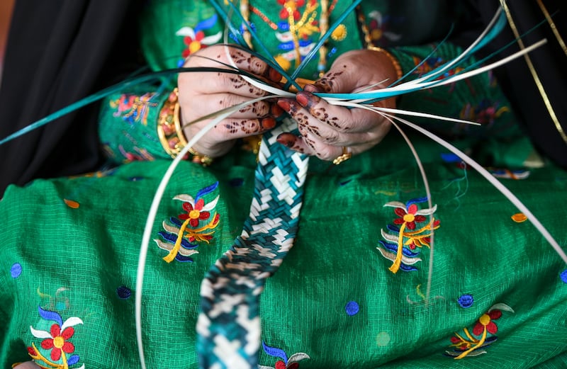 A weaving technique known as khoos, which involves braiding palm fronds, is a part of the UAE's ancestral heritage. Khushnum Bhandari / The National