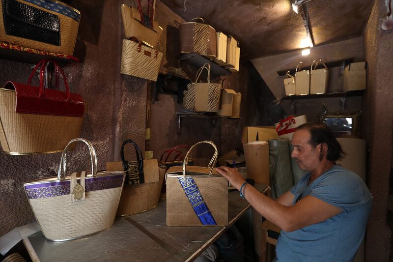 A craftsman makes a woman's handbag in a workshop in the old town of Tunis, the capital of Tunisia. UN figures suggest that there are about 350,000 artisans at work in Tunisia’s crafts industry. All photos: EPA