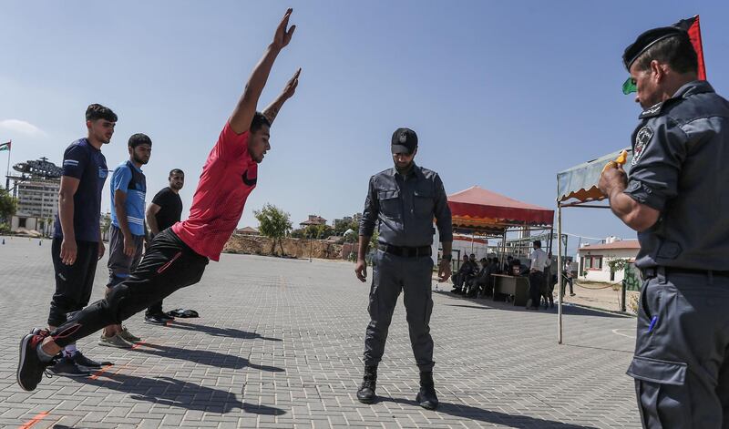 Palestinian men undergo a physical fitness examination by Hamas' security at a police training centre in Gaza City for a chance to apply for police jobs. AFP