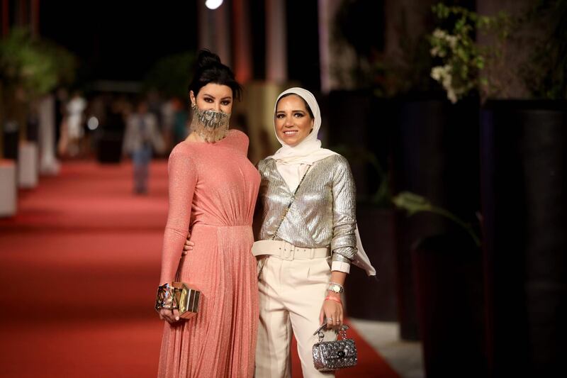 Egyptian actress Arwa Gouda and fashion designer Sara Onsi pose on the red carpet during the fourth El Gouna Film Festival on October 24, 2020. AFP