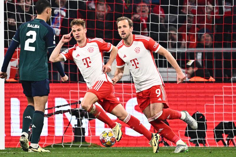 Joshua Kimmich and Harry Kane celebrate after Kimmich scores the only goal of the Champions League quarter-final second leg match between Bayern Munich and Arsenal at the Allianz Arena in Munich, Germany, on Wednesday, April 17, 2024. AP