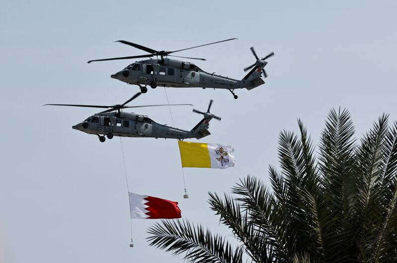 The Royal Bahraini Air Force flies the flags of Vatican City and Bahrain. Reuters