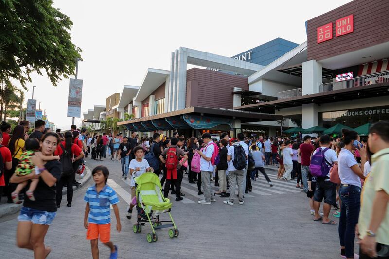 People come out from a commercial mall following the earthquake at Subic Bay Freeport in Zambales province, north of Manila. EPA