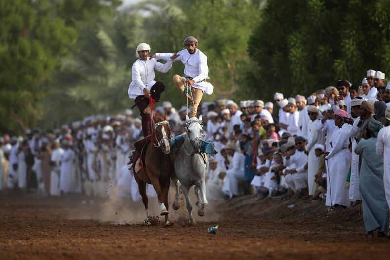 Omani horse riders take part in a traditional equestrian show in Ibra, Oman. Getty