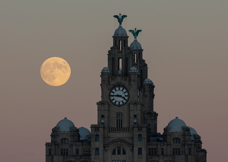 The December full moon rises above the Royal Liver Building in Liverpool, north-west England. EPA