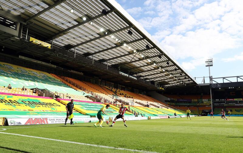 A view of the empty stands at Carrow Road. PA