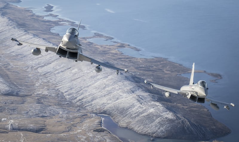 Two Typhoons flying over the Falkland Islands in a UK Ministry of Defence photo. PA