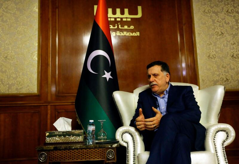 Libya's unity government Prime Minister Fayez al-Sarraj speaks during an interview with AFP in the capital Tripoli on November 8, 2018. The head of Libya's UN-backed government, Fayez al-Sarraj, urged the international community to find a "common vision" for the chaos-hit North African nation, ahead of crisis talks in Sicily next week. / AFP / Mahmud TURKIA
