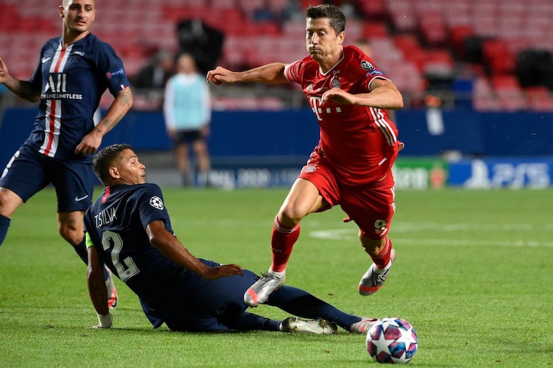 Bayern's Robert Lewandowski is brought down by PSG defender Thiago Silva. AFP