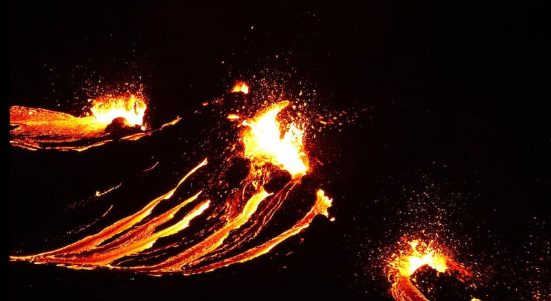 In this still image captured from a hand out video, filmed by the Icelandic Coast Guard, lava flows from the erupting Fagradalsfjall volcano some 50 km west of the Icelandic capital Reykjavik. AFP