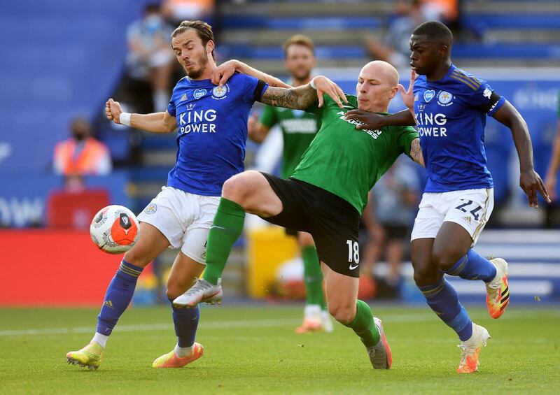 James Maddison and Nampalys Mendy of Leicester City in action against Aaron Moy of Brighton. EPA