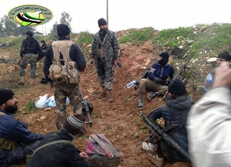 A Dec 14, 2014 photo provided by the Syrian Observatory for Human Rights,showing fighters from the Al Qaeda-linked Al Nusra Front and other rebel factions in Wadi Deif in the northwestern province of Idlib, Syria. The group is in a standoff with moderate rebels in southern Syria after the killing of a rebel commander, Mousab Ali Qarfan, from the Shuhada Al Yarmouk Brigades. Syrian Observatory for Human Rights / AP Photo