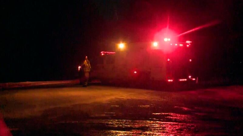 In this image taken from video, emergency services near the scene of a bus crash carrying the Humboldt Broncos of the Saskatchewan Junior Hockey League, near Nipawin, Canada, Friday April 6, 2018.  A crash between a transport truck and a bus carrying a junior hockey team in Western Canada, has left multiple people dead and others seriously injured, Canadian police said late Friday. (CTV via AP)