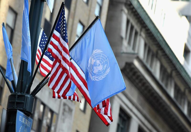 (FILES) In this file photo taken on September 23, 2019 Flags of the United Nations and the United States of America are seen in New York City. The United States on May 8, 2020 prevented a vote in the UN Security Council on a resolution on the coronavirus pandemic, apparently because it made implicit mention of the World Health Organization, diplomats said. / AFP / Angela Weiss
