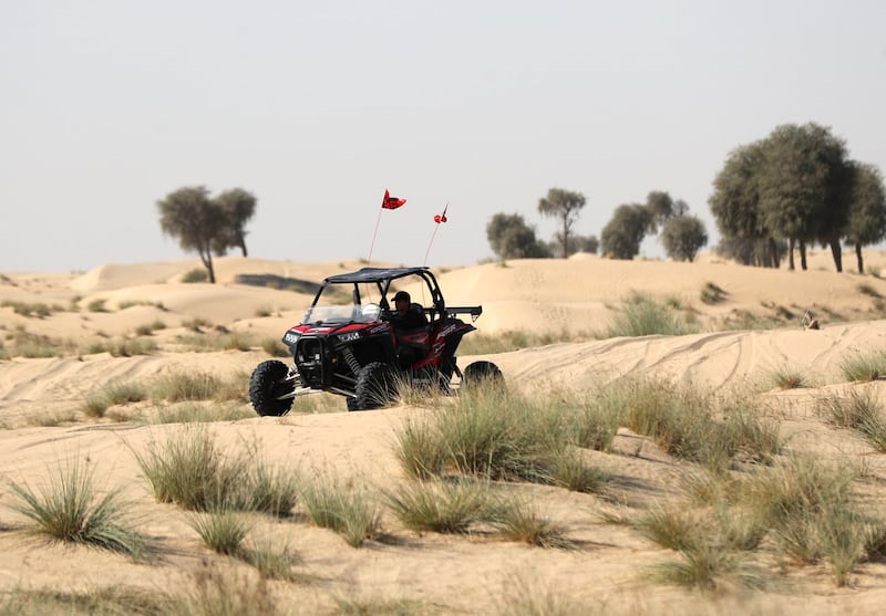 Dubai, United Arab Emirates - December 02, 2020: National Day. People enjoy taking their dune buggy for a spin in the desert on National day. Wednesday, December 2nd, 2020 in Dubai. Chris Whiteoak / The National