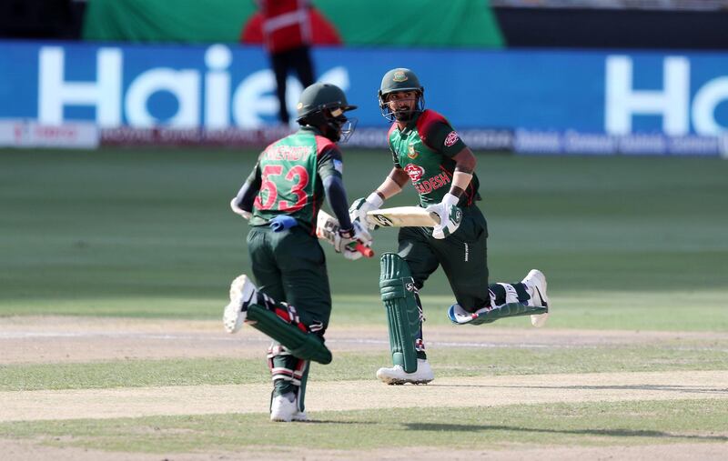 DUBAI , UNITED ARAB EMIRATES, September 28 , 2018 :- Left to Right - Mehidy Hasan and Liton Das of Bangladesh running between the wickets during the final of Unimoni Asia Cup UAE 2018 cricket match between Bangladesh vs India held at Dubai International Cricket Stadium in Dubai. ( Pawan Singh / The National )  For News/Sports/Instagram/Big Picture. Story by Paul