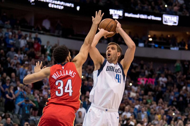 Mar 18, 2019; Dallas, TX, USA; Dallas Mavericks forward Dirk Nowitzki (41) makes a basket over New Orleans Pelicans guard Kenrich Williams (34) during the first quarter at the American Airlines Center to become the sixth all-time leading scorer in NBA history. Mandatory Credit: Jerome Miron-USA TODAY Sports