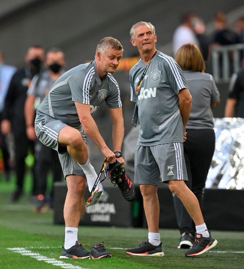 Manchester United manager Ole Gunnar Solskjaer puts on his shoes prior to a training session ahead of the Europa League quarter-final match against FC Copenhagen in Cologne, Germany. Getty Images