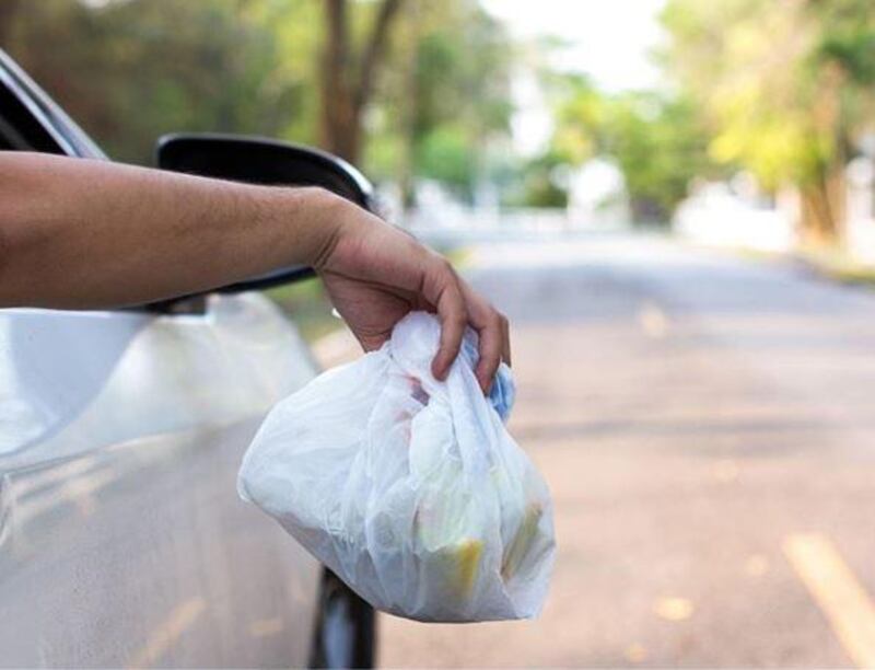 Drivers face Dh1,000 fine and six points on their licence if caught throwing rubbish from a vehicle. Courtesy: Abu Dhabi Police