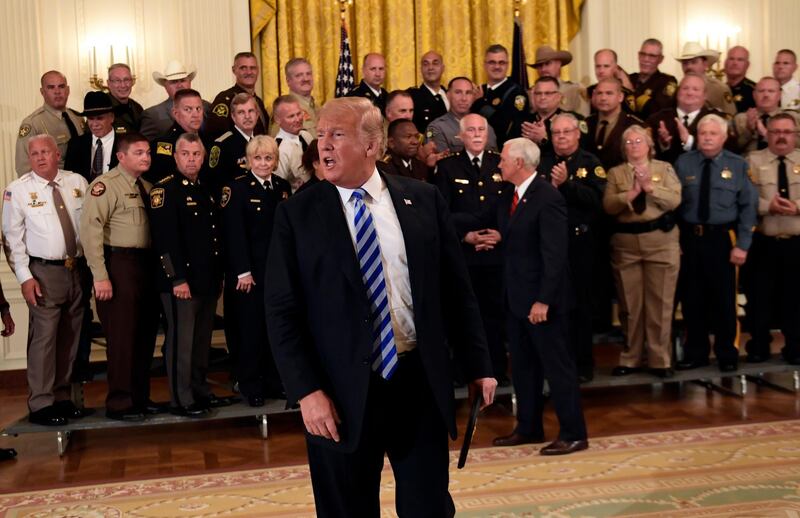 In this Sept. 5, 2018, photo, President Donald Trump responds to a reporters question during an event with sheriffs in the East Room of the White House in Washington. (AP Photo/Susan Walsh)