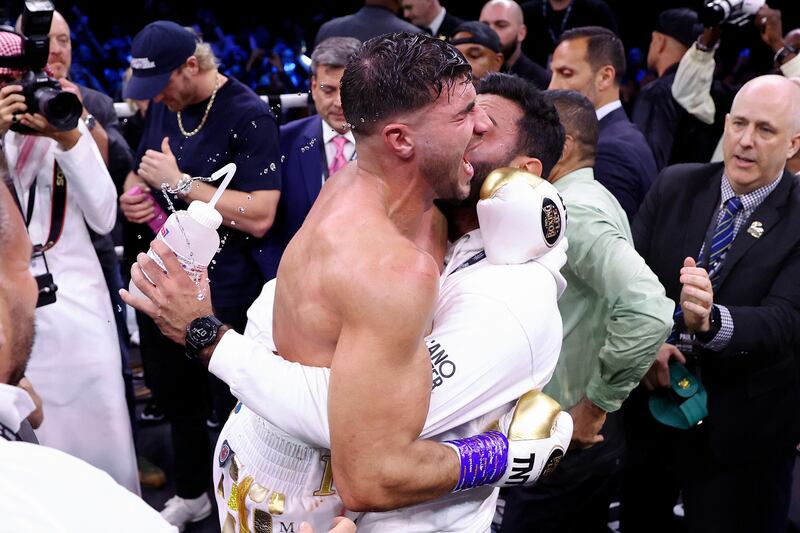 Tommy Fury celebrates with his coaching team after defeating Jake Pau. Getty Images