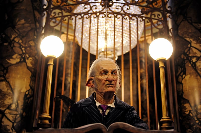 A goblin greets guests at the entrance to Harry Potter and the Escape from Gringotts in Orlando. Reuters