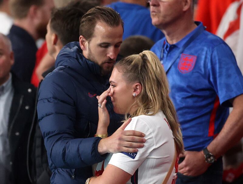 England's Harry Kane and wife Katie Goodland look dejected after the penalty shoot-out defeat to Italy in the final of Euro 2020.