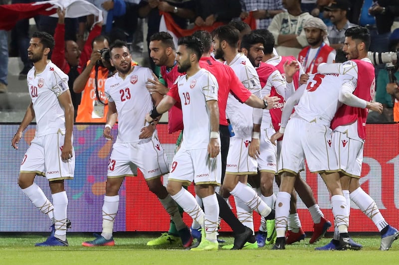 Bahrain's Jamal Rashed, second left, celebrates after scoring a goal. AFP