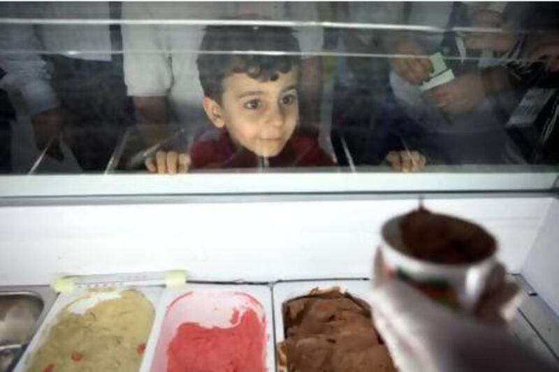 Five-year-old Khalid Abdulrahim waits patiently for his free ice cream during the Health & Fitness Fun Day at the Abu Dhabi National Exhibition Center in Abu Dhabi. The two-day event offers free health screenings and counseling, fitness activities as well as different snacks. Silvia Razgova / The National