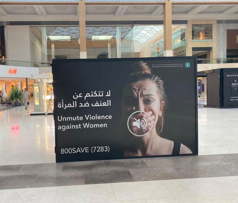 A campaign poster highlighting the issue of gender-based violence in Abu Dhabi. The National
