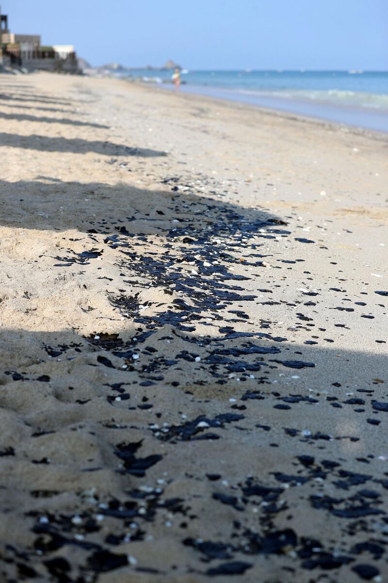 Fujairah, United Arab Emirates - November 02, 2019: Oil has washed up on a beach in Fujairah. Monday the 4th of November 2019. Fujairah. Chris Whiteoak / The National