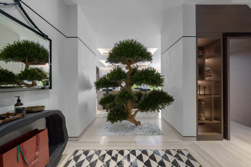 A large bonsai tree welcomes you at the property's entrance. Photos: Luxhabitat Sotheby's International Realty