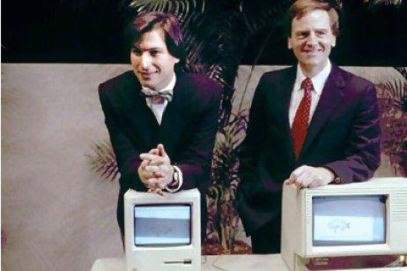 Steve Jobs, left, presents the new Macintosh personal computer with then chief executive John Sculley in 1984. Paul Sakuma / AP Photo