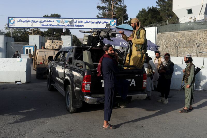 Members of the Taliban guard the entrance to Hamid Karzai International Airport in Kabul. Reuters