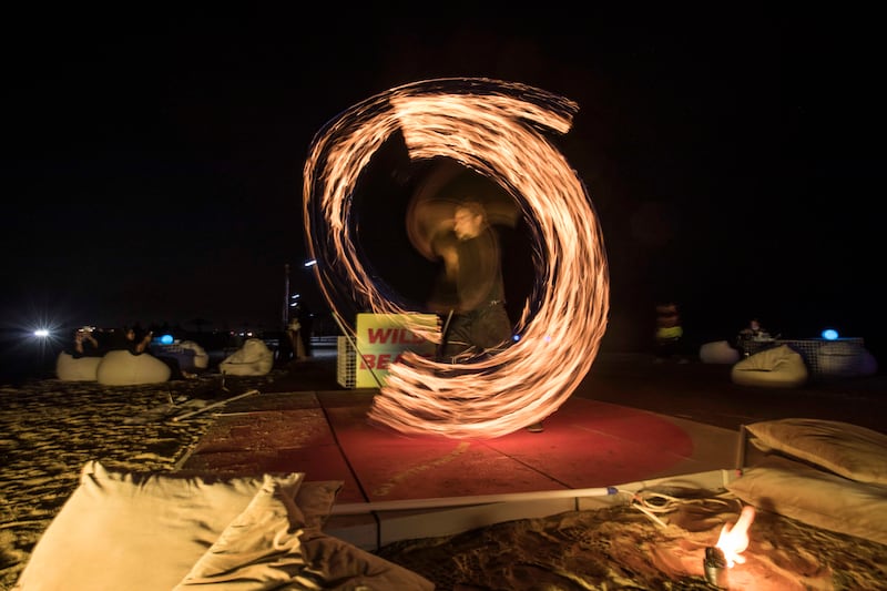 The fun continues after dark with fire dancers and DJs