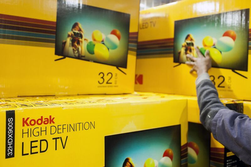 An employee stacks an Eastman Kodak Co. HD LED TV in a packaging room at the Super Plastronics Pvt. (SSPL) plant in Noida, Uttar Pradesh, India, on Monday, Nov. 27, 2017. India's economic growth bounced back from a three-year low, giving the central bank enough ammunition to keep interest rates on hold Dec. 6 amid an uptick in inflationary pressures. Photographer: Udit Kulshrestha/Bloomberg