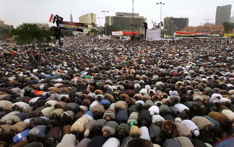 Thousands of Egyptians perform Friday prayers during a rally in Cairo's Tahrir square, Egypt, Friday, Nov.18, 2011 in a protest against what they say are attempts by the country's military rulers to reinforce their powers.  The rally Friday was dominated by the country's most organized political group, the Muslim Brotherhood. It was called to protest a document floated by the government which declares the military the guardian of "constitutional legitimacy," suggesting the armed forces could have the final word on major policies.   (AP Photo/Amr Nabil) *** Local Caption ***  Mideast Egypt.JPEG-0e7d0.jpg