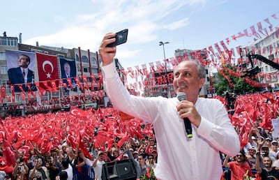 Muharrem Ince, presidential candidate of Turkey's main opposition Republican People's Party, takes a selfie picture at the end of his address at an election rally in Corlu, Turkey, Wednesday, June 20, 2018. Turkey holds parliamentary and presidential elections on June 24, 2018, deemed important as the vote will be a game changer, putting into full force constitutional changes transforming Turkeyâ€™s ruling system into an executive presidency. (CHP Press Service/Pool Photo via AP)